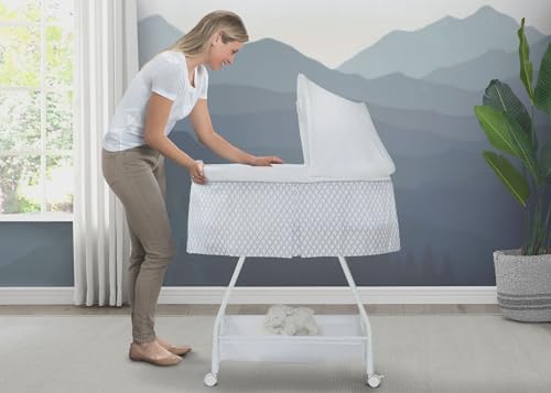 Delta Children Deluxe Soothing Dreams Bassinet with Nightlight and Music